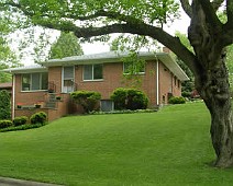 HH05-Lakewood2 This house sits on a slight hill with beautiful views of the mature trees this neighborhood has to offer.